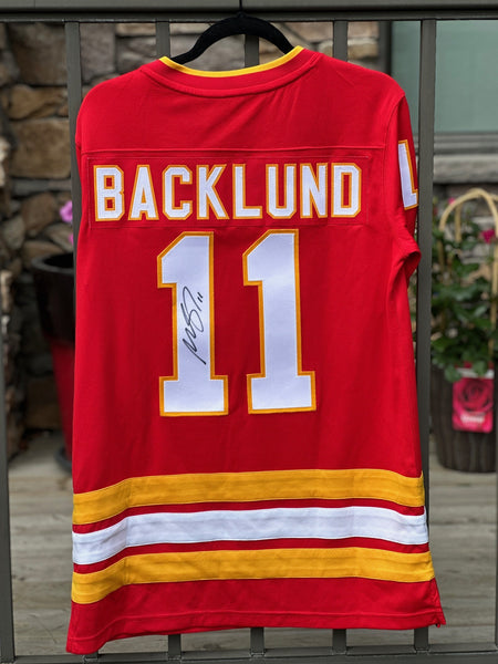Mikael Backlund signed Flames Jersey (red) + Memories in Bloom hoodie